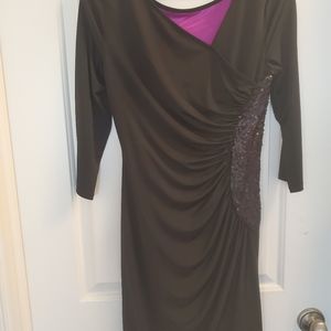 Fitted black dress with sequences on side